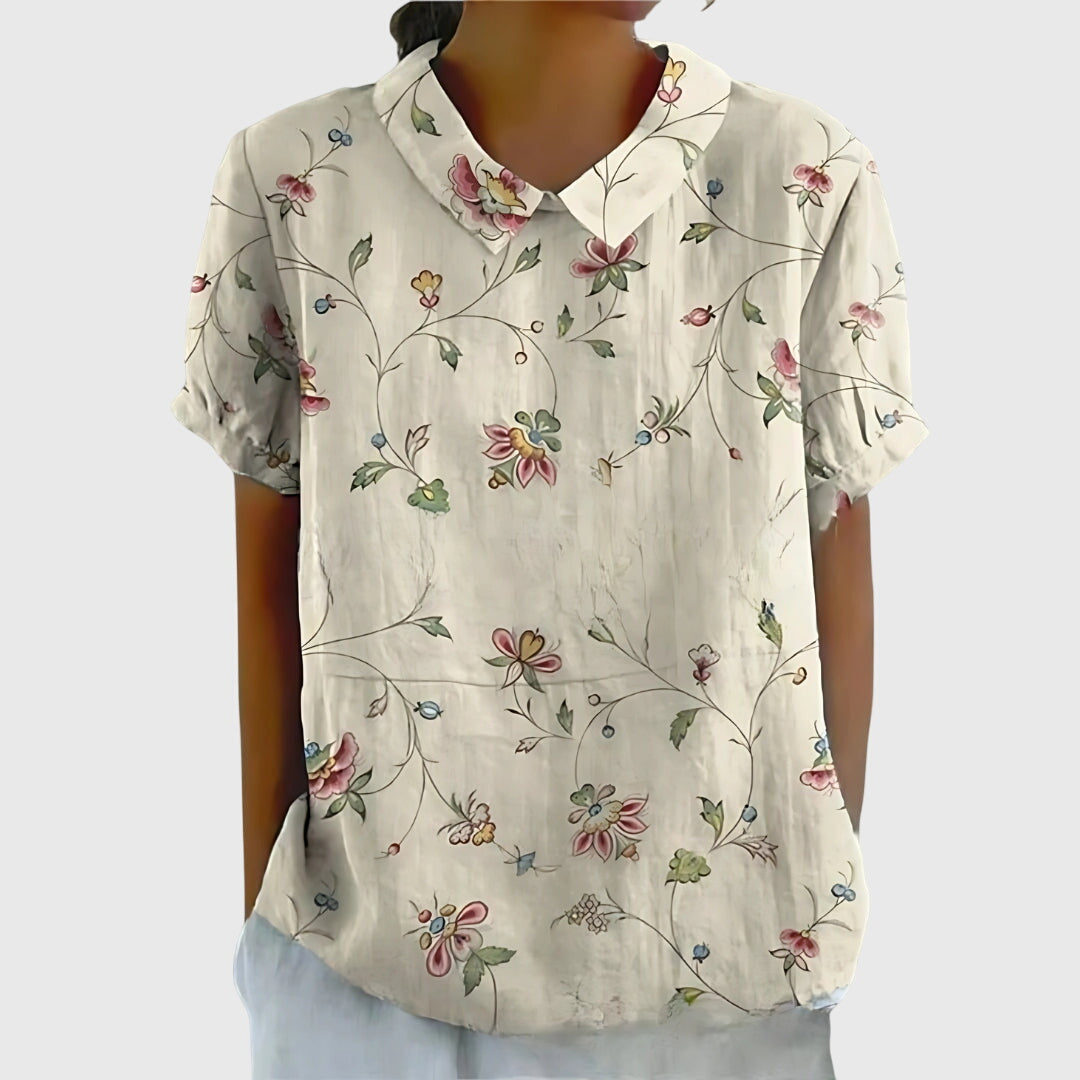 Jesie-London Eleanor women's floral collar short sleeve blouse with a stylish design and vibrant flower pattern.