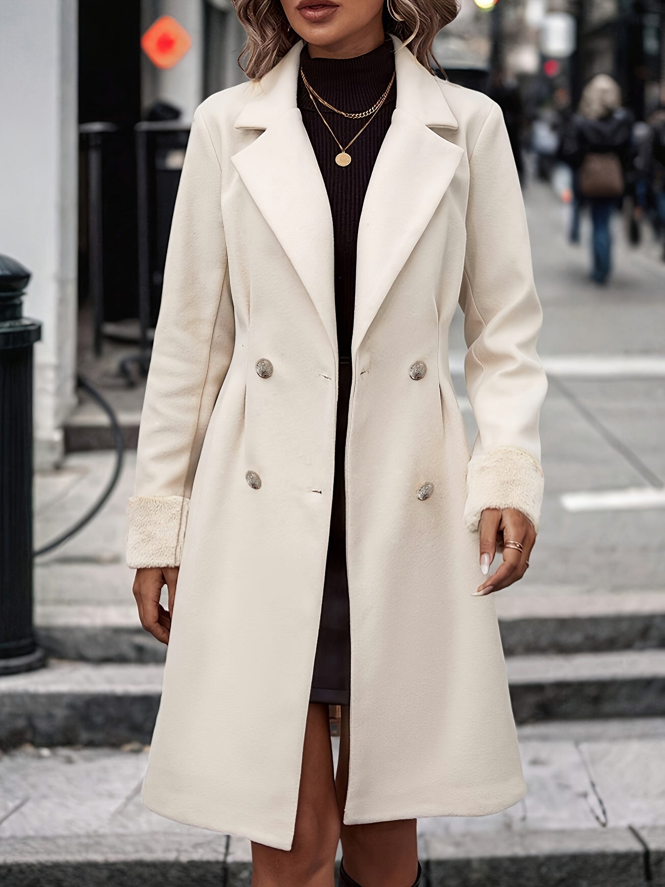 Elegant women's long double-breasted coat from Jesie-London, featuring a tailored fit and classic style.