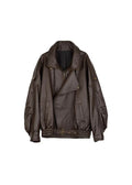 Esme Jesie-London women's oversized leather bomber jacket displayed on a hanger, showing its classic design and rich leather texture.