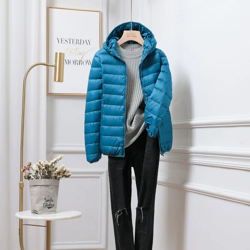 Jesie-London Chloe women’s hooded zip puffer jacket with quilted design and front pockets, perfect for cold weather.