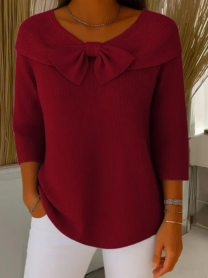 Jesie-London Anna women's three-quarter sleeve top with bow detail, showcasing a stylish and elegant design.