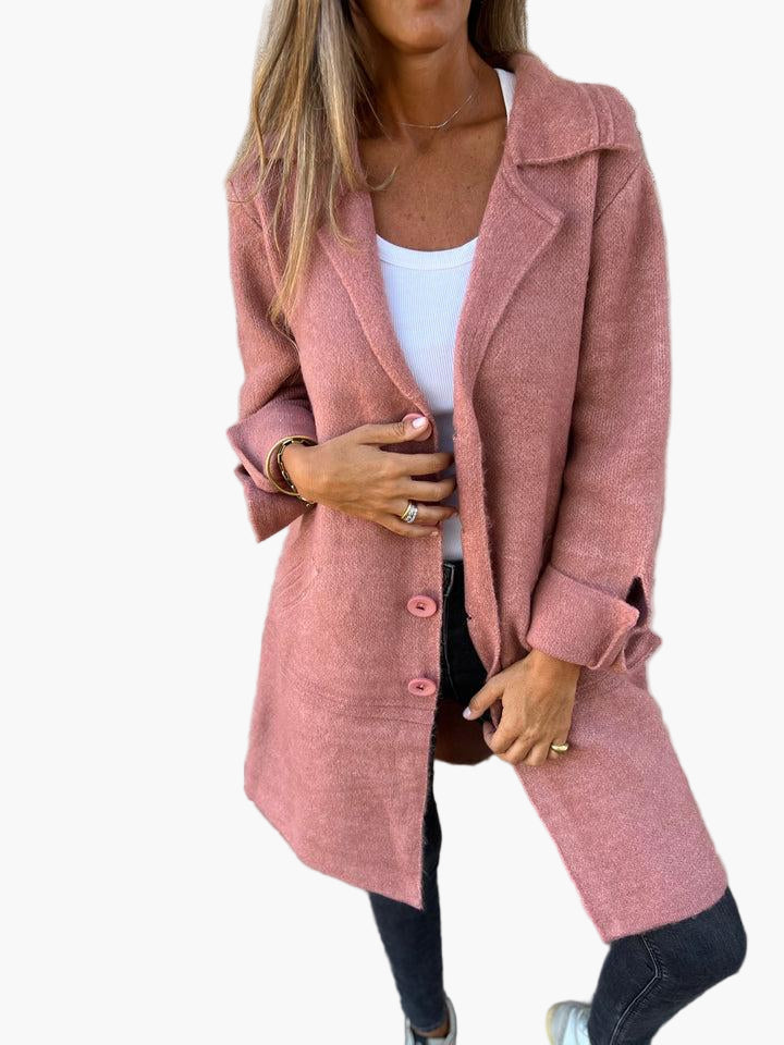 Women's cozy oversized button-down trench coat by Jesie-London, in neutral fabric with large front buttons and soft collar detail.
