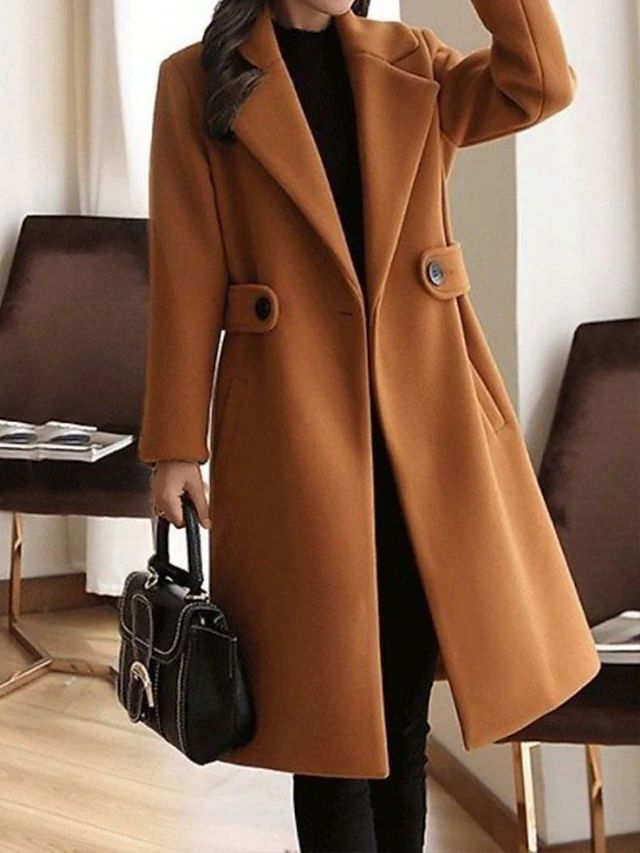 Women’s elegant long formal trench coat by Jesie-London, featuring tailored fit and classic design, shown on a model.