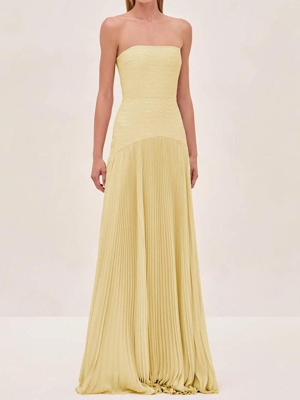 Clara women's strapless pleated maxi wedding guest dress by Jesie-London, featuring a flowing silhouette and elegant design.