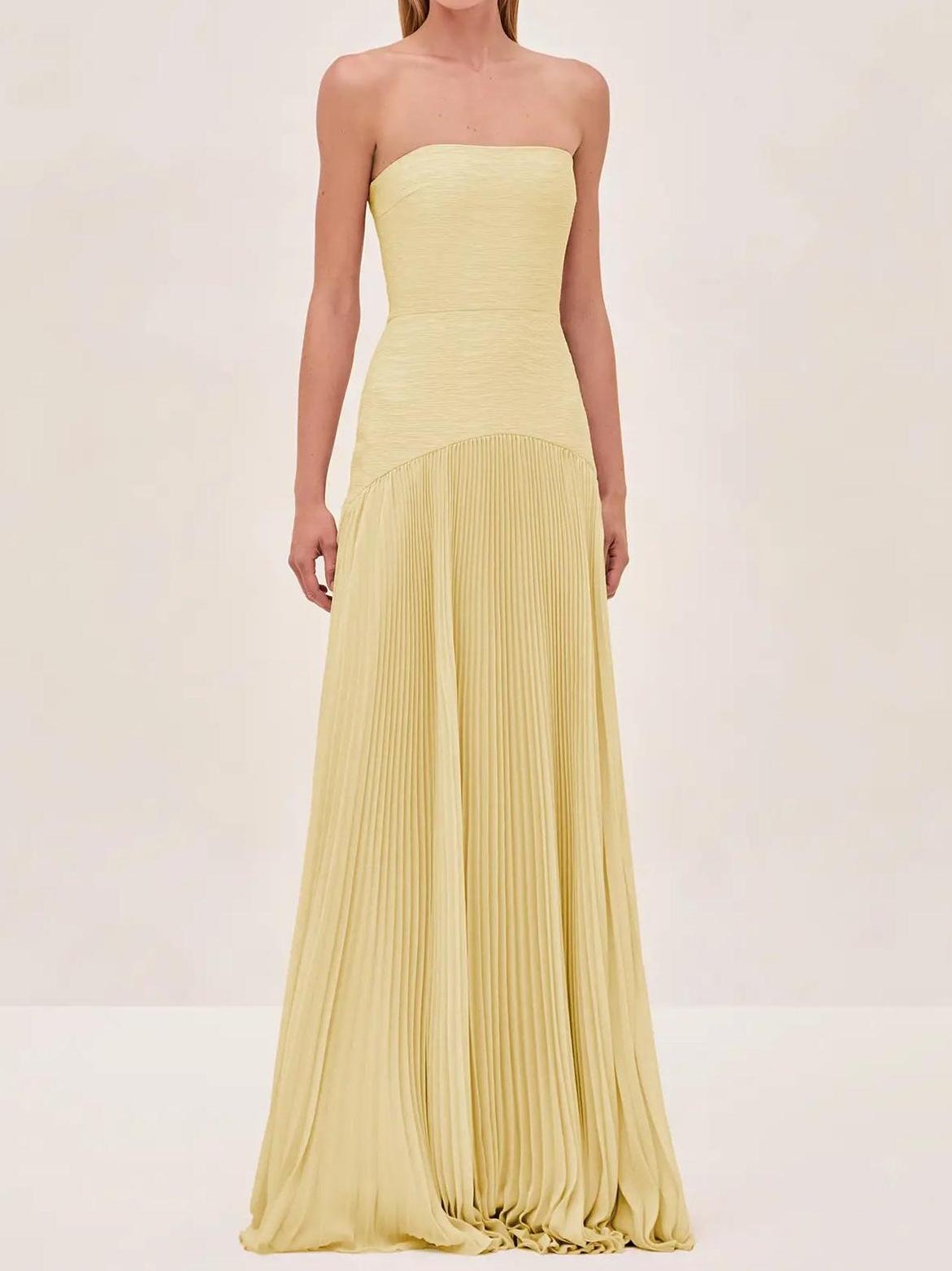 Clara women's strapless pleated maxi wedding guest dress by Jesie-London, featuring a flowing silhouette and elegant design.