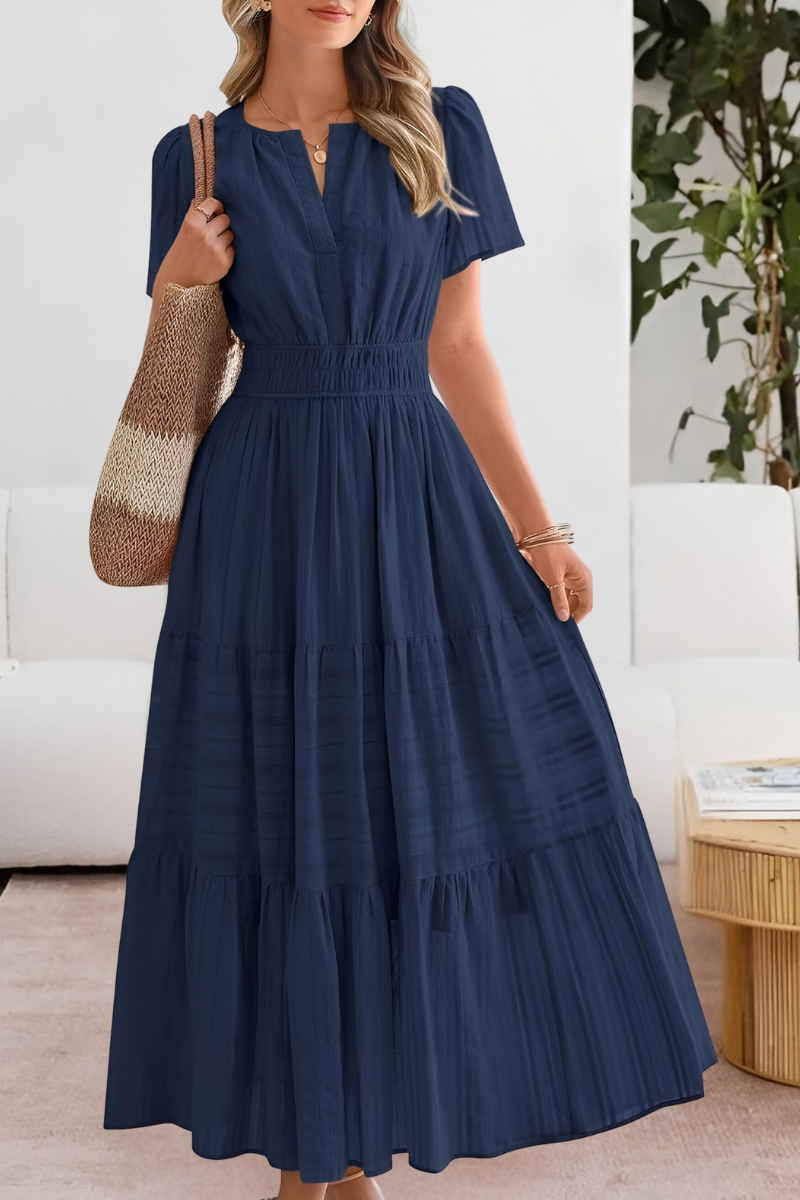 Jesie-London Alice women's boho short sleeve smocked midi dress displayed on a hanger with floral pattern and relaxed fit.