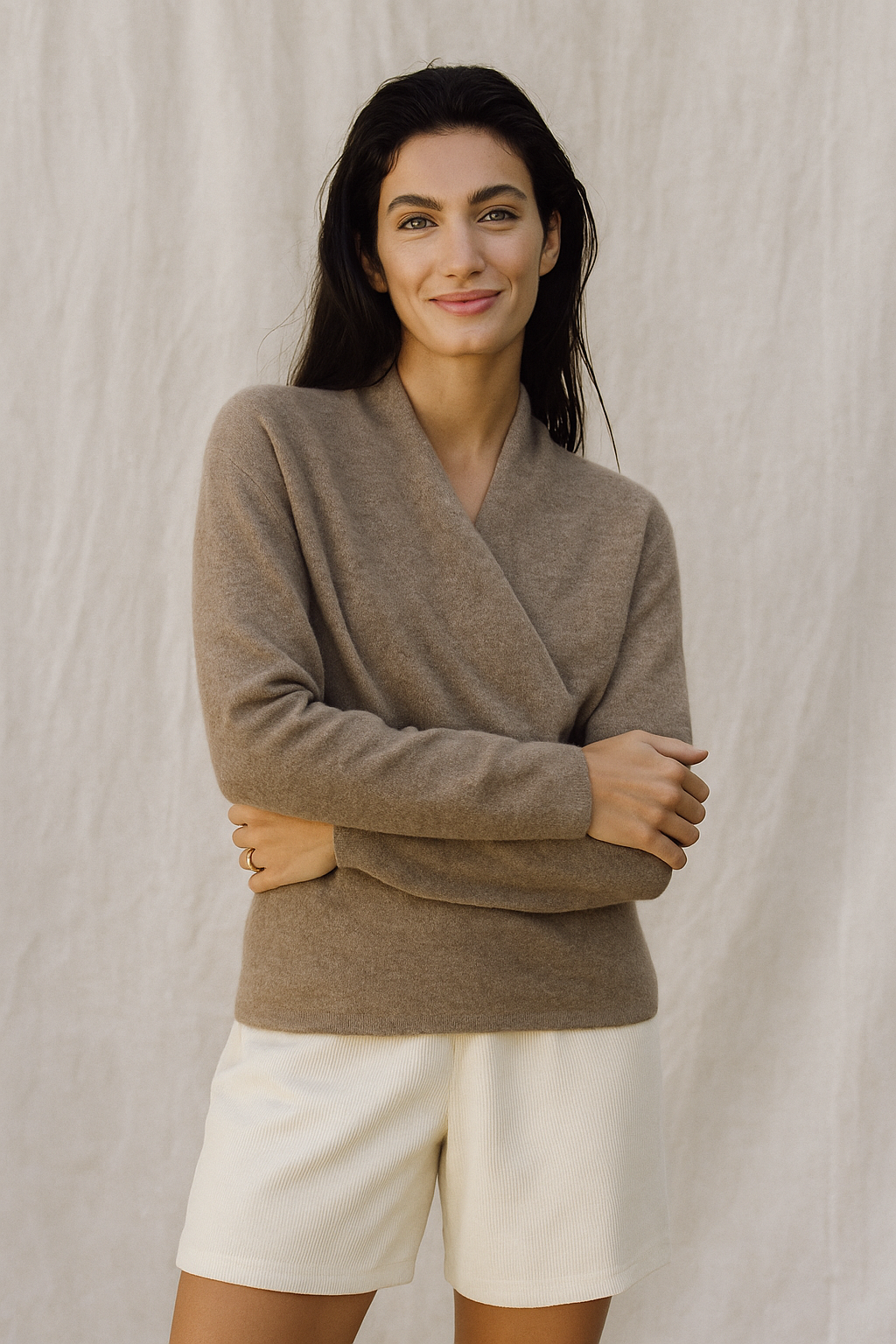 Woman wearing Jesie-London Elizabeth women's winter V-neck knit sweater, cozy wrap design, in a casual indoor setting.