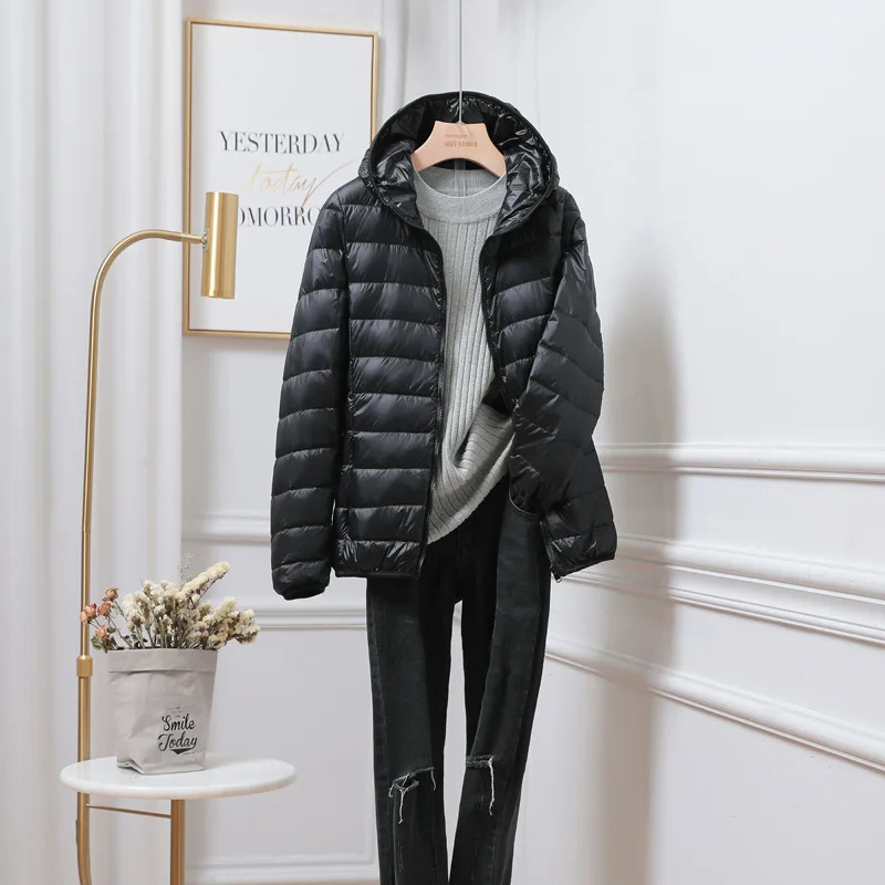 Jesie-London Chloe women's hooded zip puffer jacket in black, featuring a quilted design and adjustable hood.