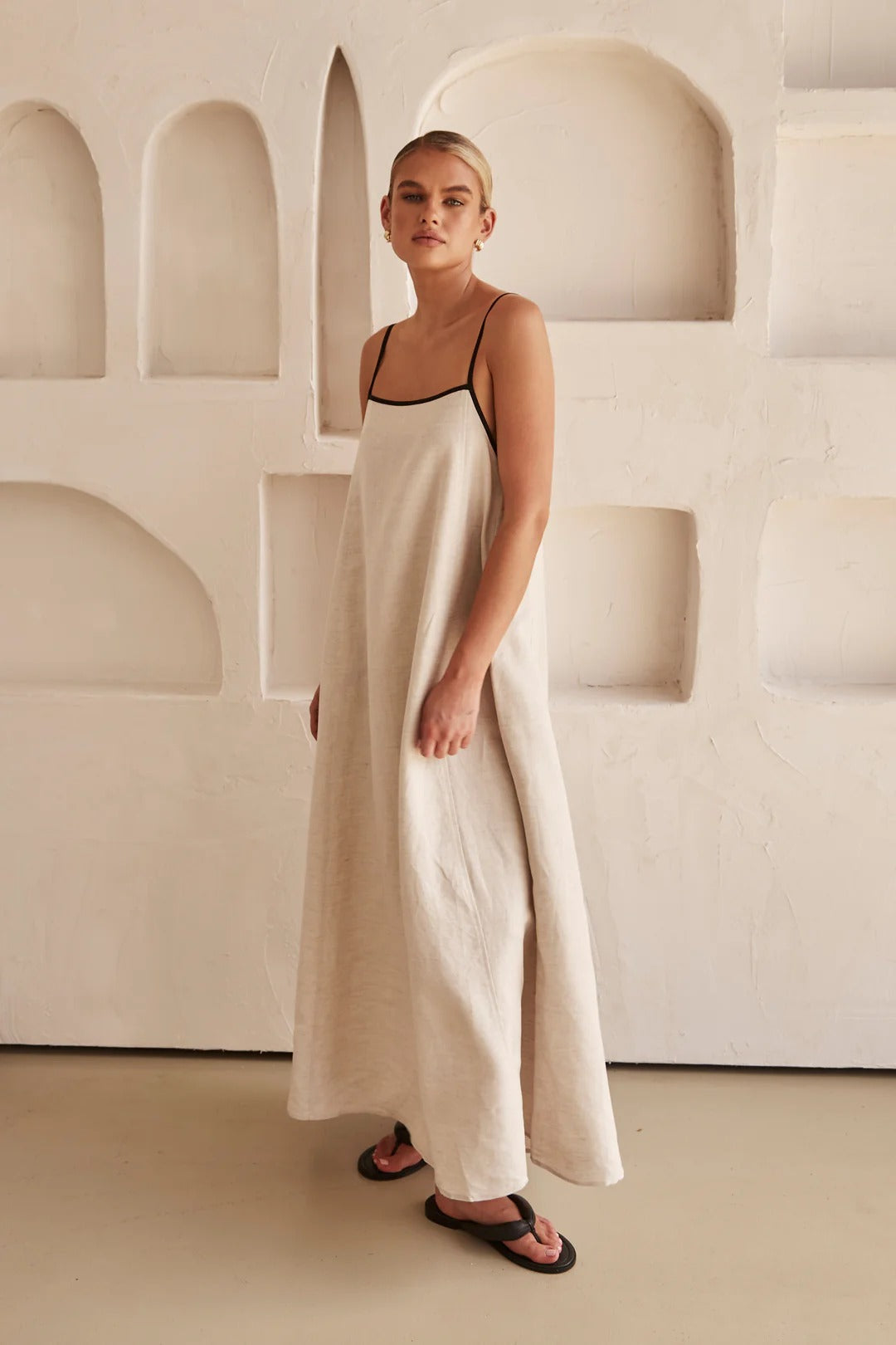 Jesie-London Florence women's spaghetti strap maxi dress, elegant wedding guest gown with flowing fabric and a fitted bodice.