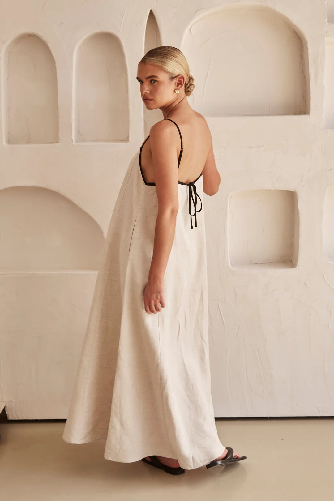 Jesie-London Florence women's spaghetti strap maxi dress, elegant wedding guest gown with flowing fabric and fitted bodice.