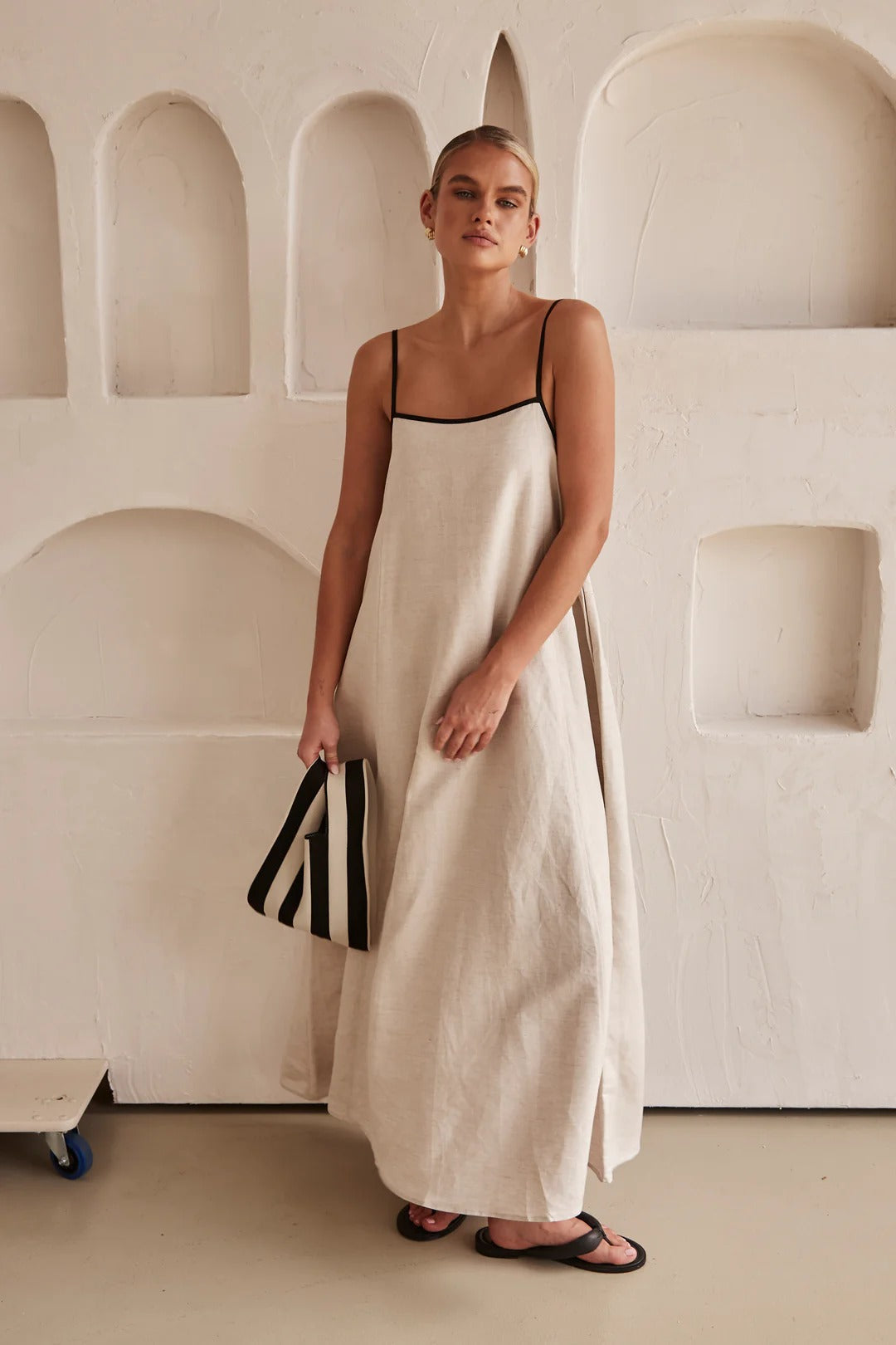 Jesie-London Florence women's spaghetti strap maxi dress, elegant wedding guest gown with flowing fabric and fitted bodice.
