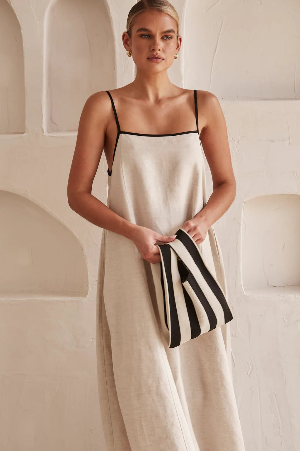 Jesie-London Florence women's spaghetti strap maxi dress, elegant wedding guest dress with flowing fabric and delicate straps.