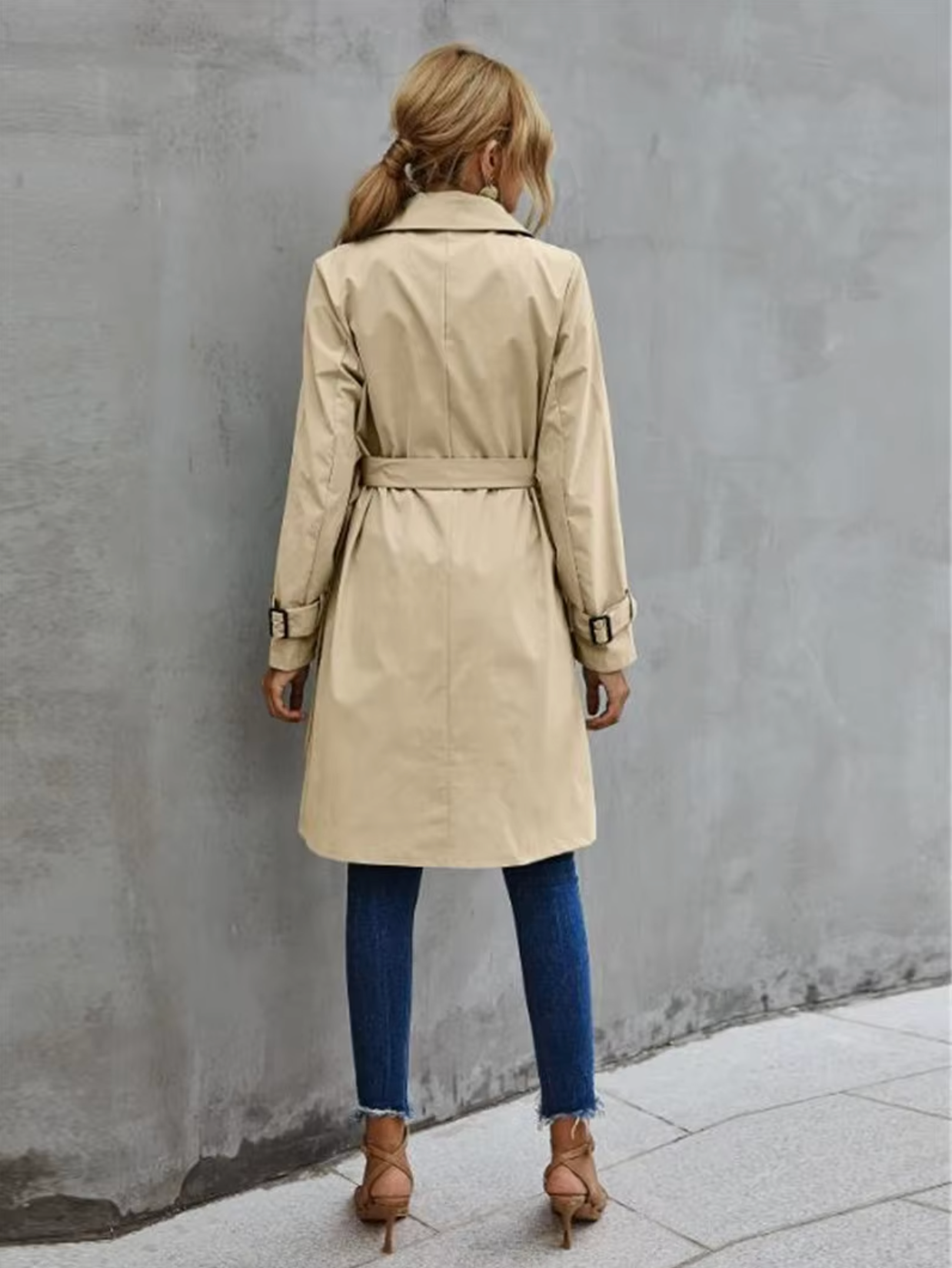 Jesie-London Stella women's trench coat with double buttons and belt, shown on a hanger with a neutral background.