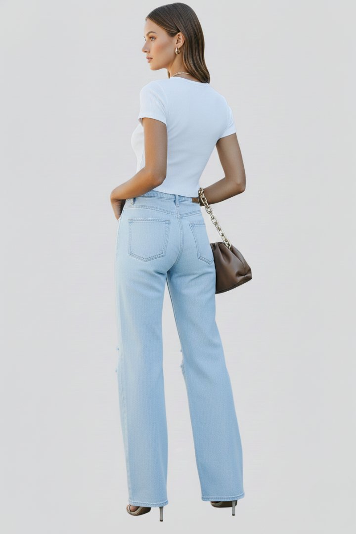 Jesie-London Laura women's wide-leg distressed high-waist jeans shown hanging on a rack with a casual fit and frayed hems.