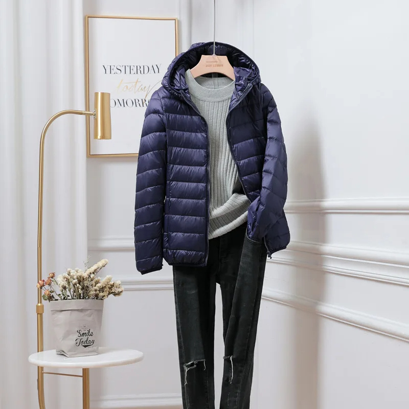 Jesie-London Chloe women's hooded zip puffer jacket with quilted design and front zipper, perfect for cold weather.