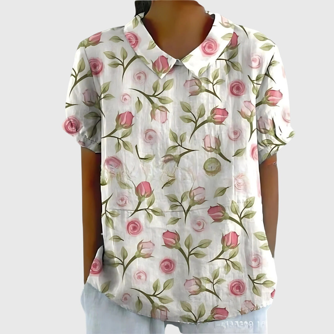 Jesie-London Eleanor women's floral collar short sleeve blouse with feminine design and colorful flower pattern.