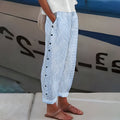 Women’s striped casual pants with button details from Jesie-London, featuring a relaxed fit and stylish design.