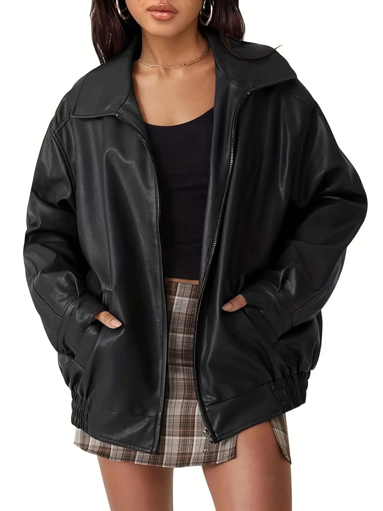 Women’s oversized leather bomber jacket by Jesie-London, featuring a classic design and sleek silhouette, shown in black.