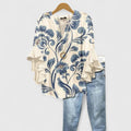Women's floral ruffle sleeve casual top by Jesie-London, featuring a feminine design with colorful flower patterns and ruffle accents.