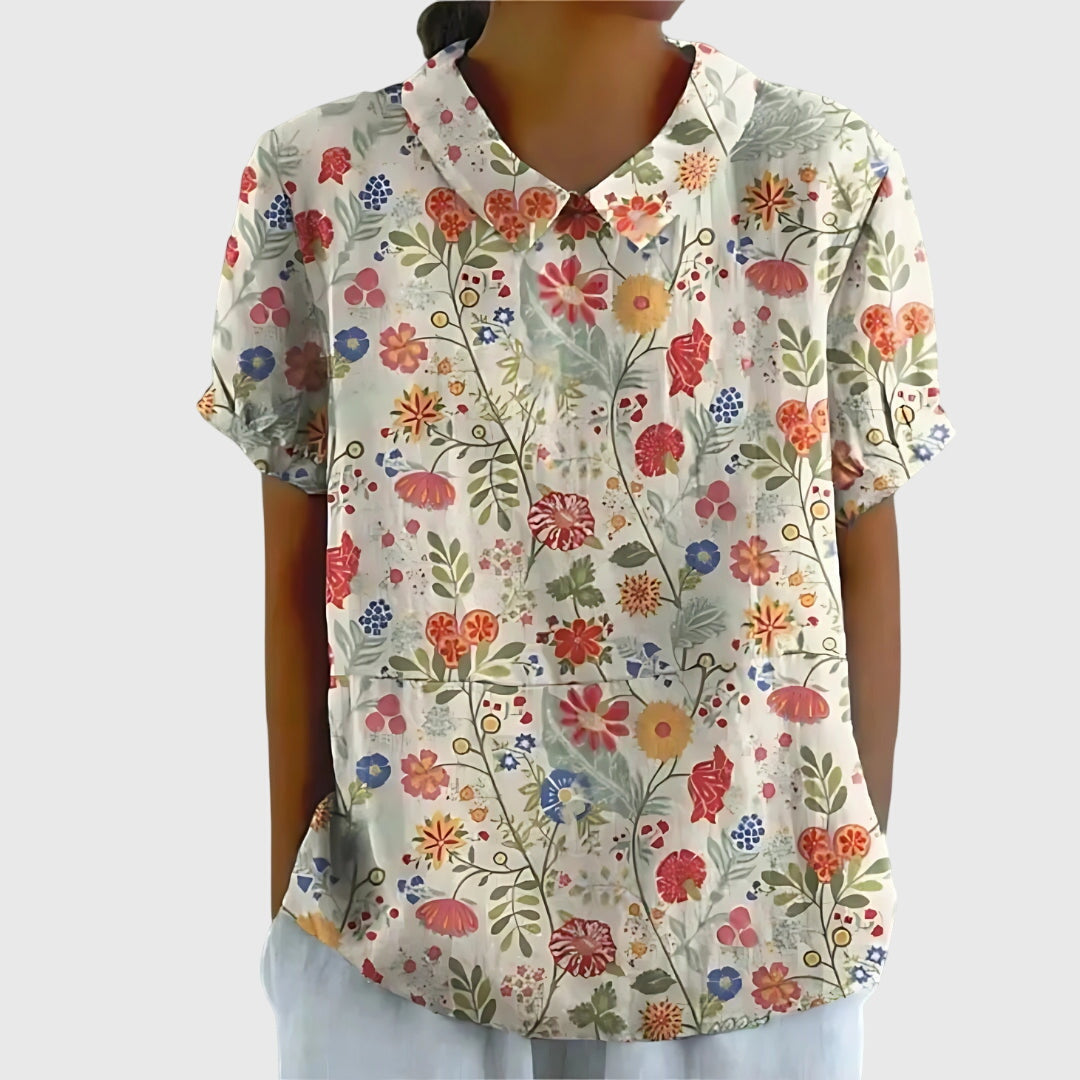 Jesie-London Eleanor women's floral collar short sleeve blouse with elegant design and vibrant print, perfect for casual or office wear.