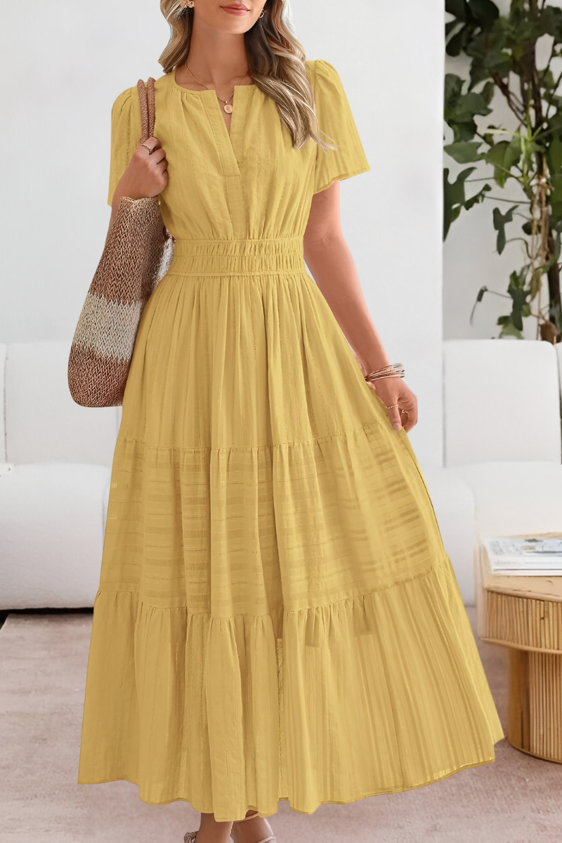 Women's boho short sleeve smocked midi dress by Jesie-London featuring a relaxed fit and floral pattern on lightweight fabric.
