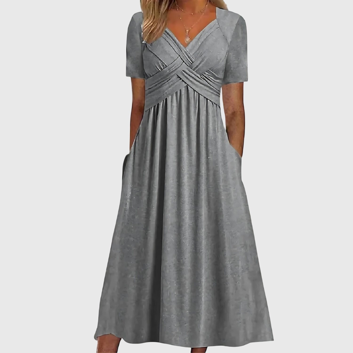Jesie-London Megan women's v-neck flowy midi dress displayed on a hanger with soft fabric folds.