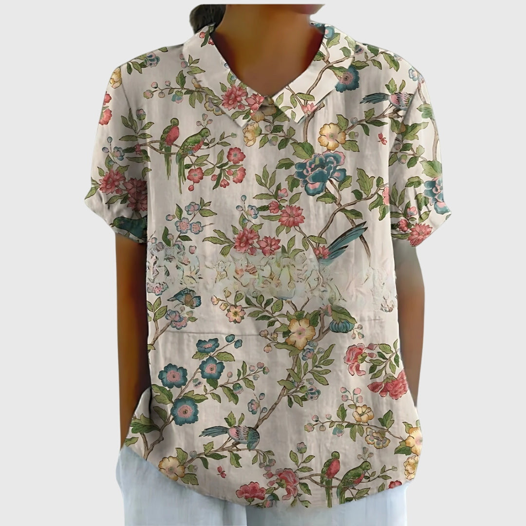 Jesie-London Eleanor women's floral collar short sleeve blouse, light fabric with colorful floral pattern and stylish design.