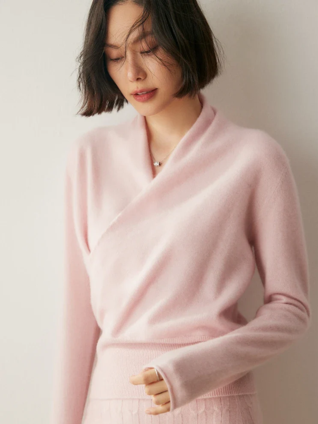 Jesie-London Kate women's elegant wrap crossover chic sweater in soft knit, shown on a model with a stylish, sophisticated look.