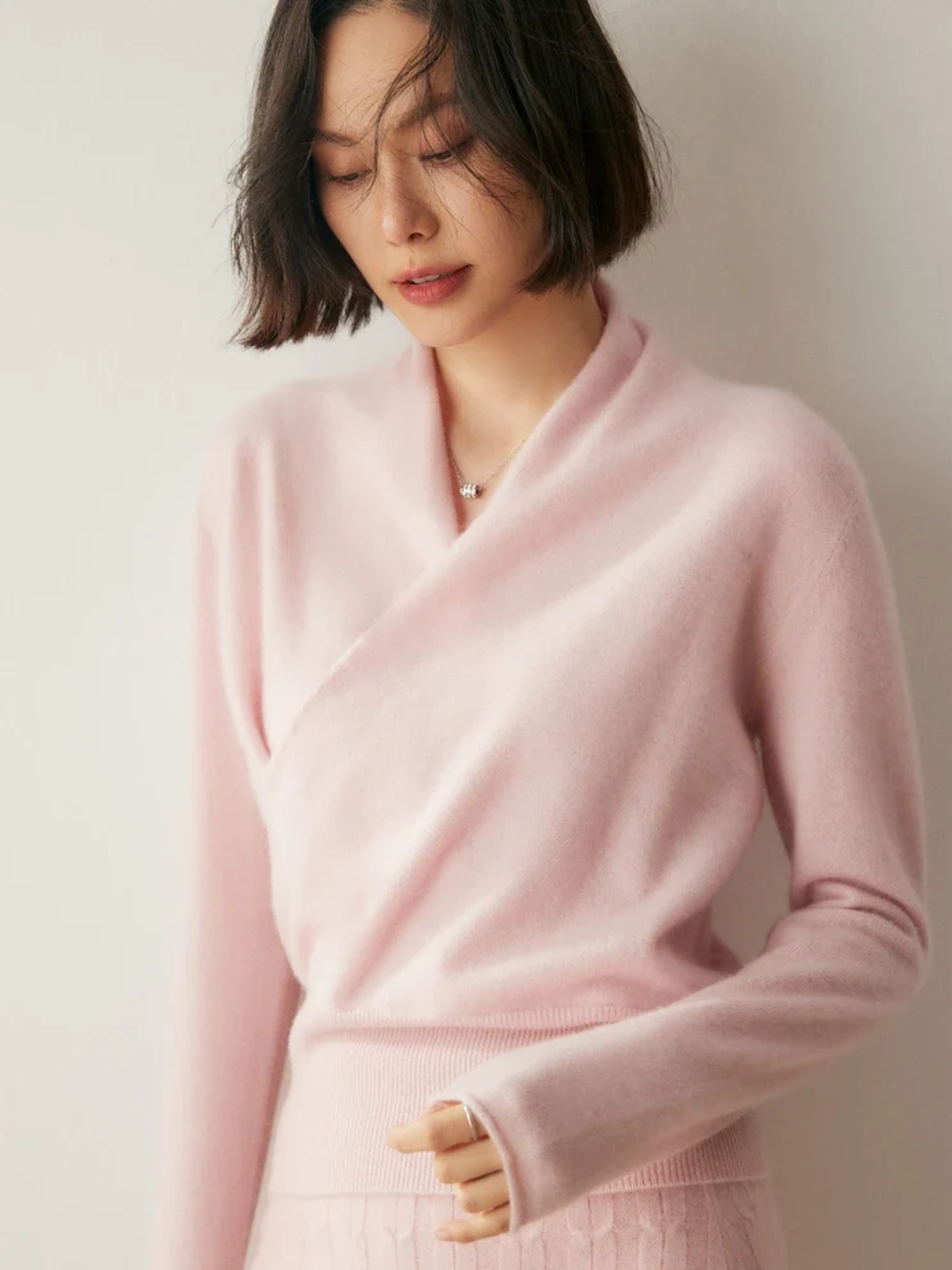 Jesie-London Kate women's elegant wrap crossover chic sweater in soft knit, shown on a model with a stylish, sophisticated look.