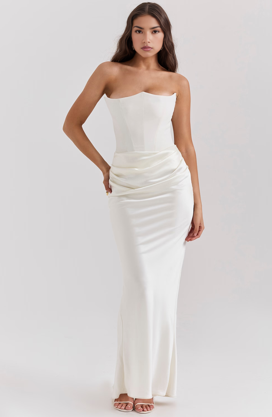 Jesie-London Camille strapless corset bodycon maxi dress worn by a woman, featuring a sleek, fitted design perfect for formal occasions.