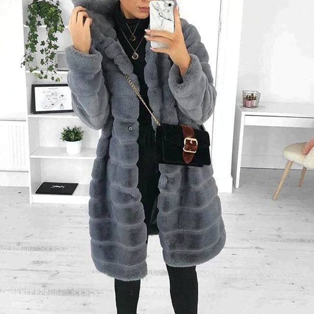 Jesie-London Florence women's longline faux fur coat with hood, soft shaggy warmth, ideal for winter outdoor wear.