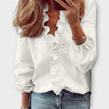 Women’s ruffle V-neck long sleeve blouse by Jesie-London, in soft fabric with feminine ruffle details and a relaxed fit.