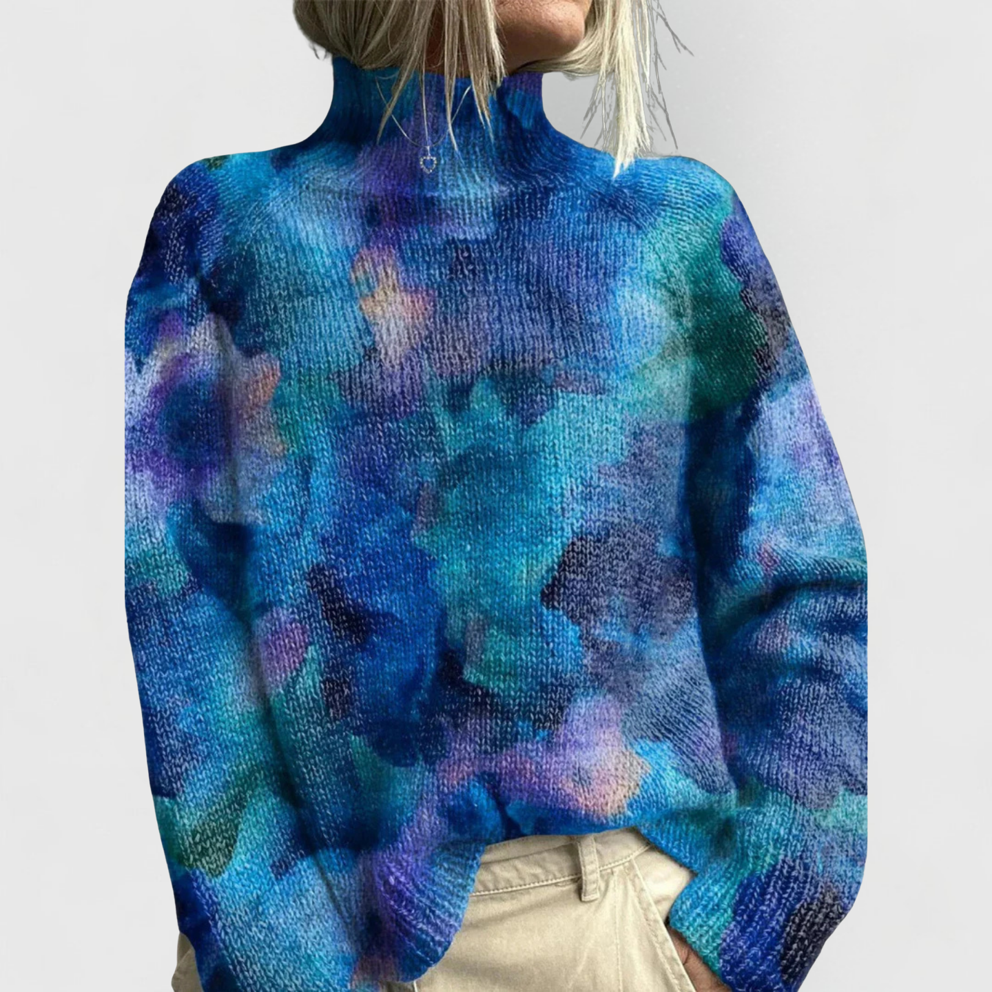 Women's cozy knit sweater by Jesie-London featuring a nature print, styled with a short sleeve shirt and pants in the image.