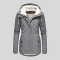 Jesie-London Charlotte women's hooded lightweight waterproof rain jacket, shown in a vibrant color, with adjustable hood and waterproof fabric