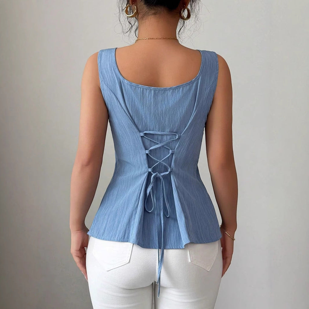 Women’s sleeveless square neck peplum top by Jesie-London, in a floral print, perfect for spring, shown on a model.