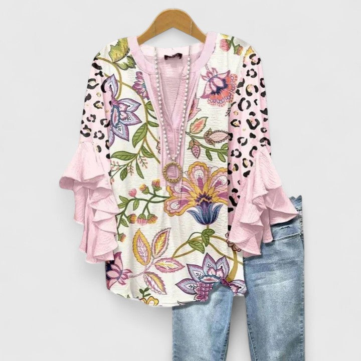 Jesie-London Katie women's floral ruffle sleeve casual top displayed with colorful floral pattern and ruffle detailing on the sleeves.