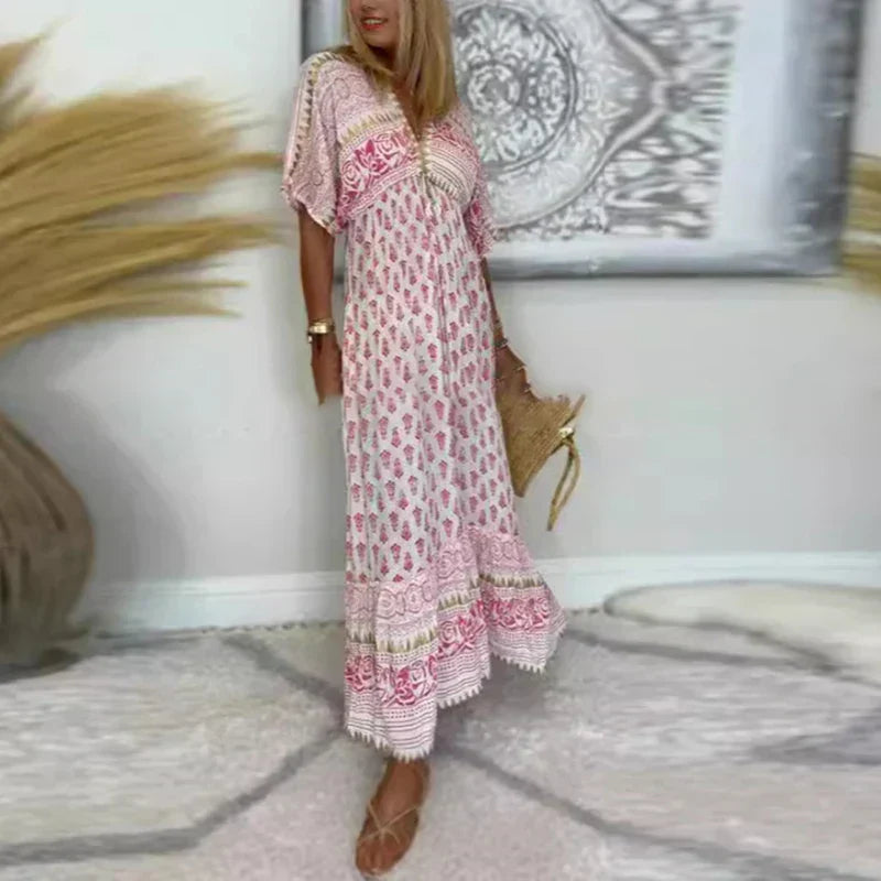 Jesie-London Amelia women's boho tassel detail short sleeve maxi dress, flowing style with tassel accents in a vibrant, comfortable design.