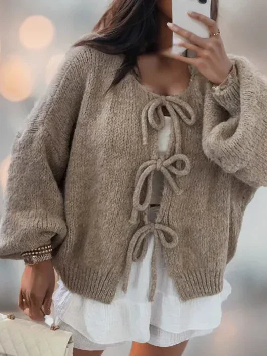 Jesie-London Ella women's soft knit cardigan with bow ties, styled with long sleeves and a cozy, elegant fit.