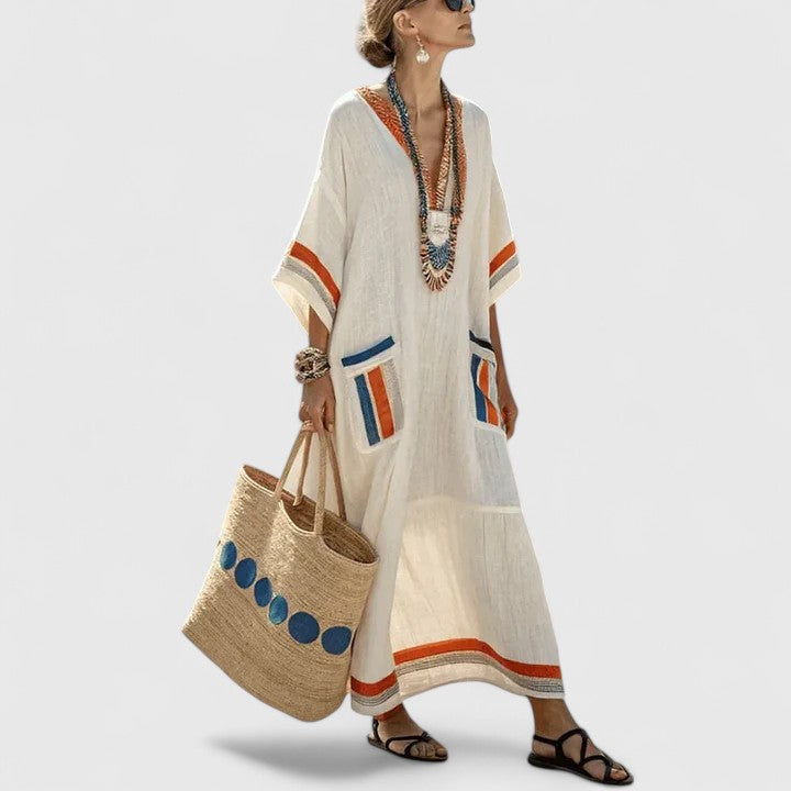 Women's loose fit pocket maxi dress by Jesie-London, featuring a flowing silhouette and casual design, shown in the image.