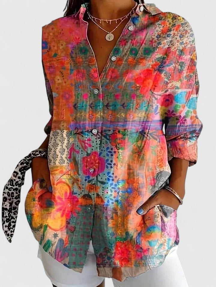 Women's colorful floral button-up shirt by Jesie-London, featuring vibrant flower patterns and a classic collar.