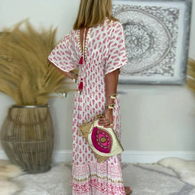 Jesie-London Amelia women's boho short sleeve maxi dress with tassel details, flowing design and vibrant bohemian style.