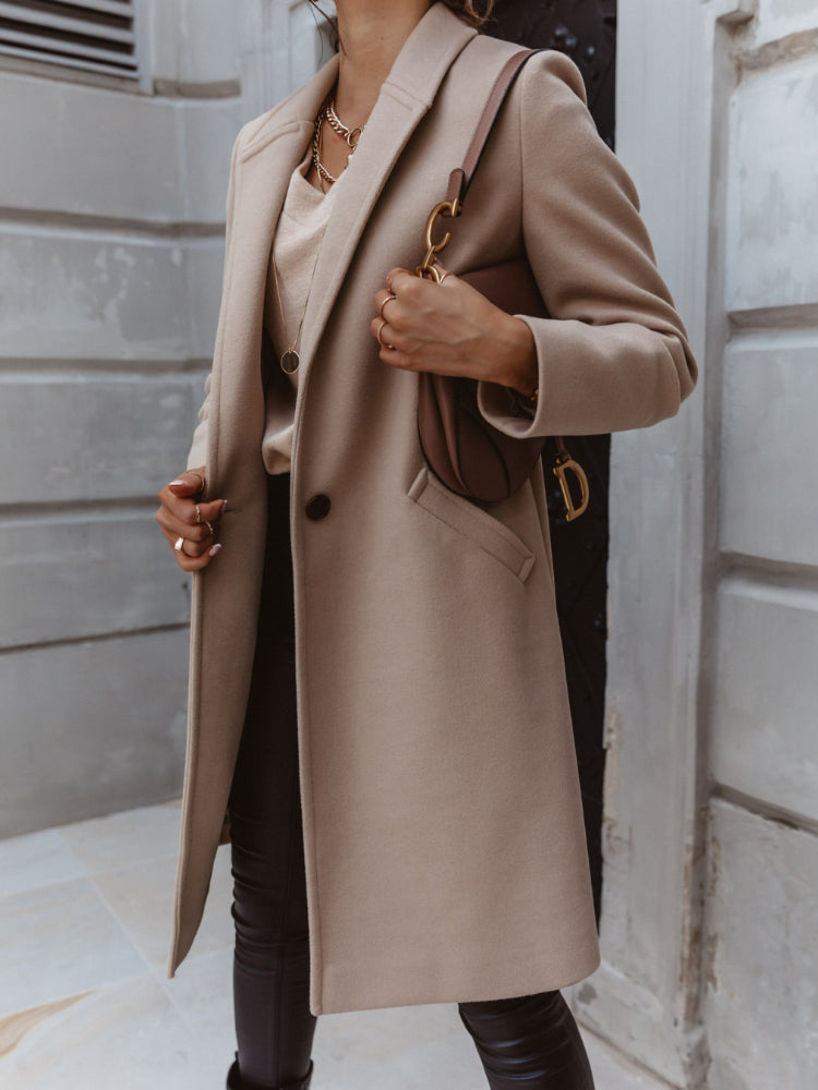 Elegant women's formal button-front coat by Jesie-London, featuring a tailored design and classic style perfect for professional attire.