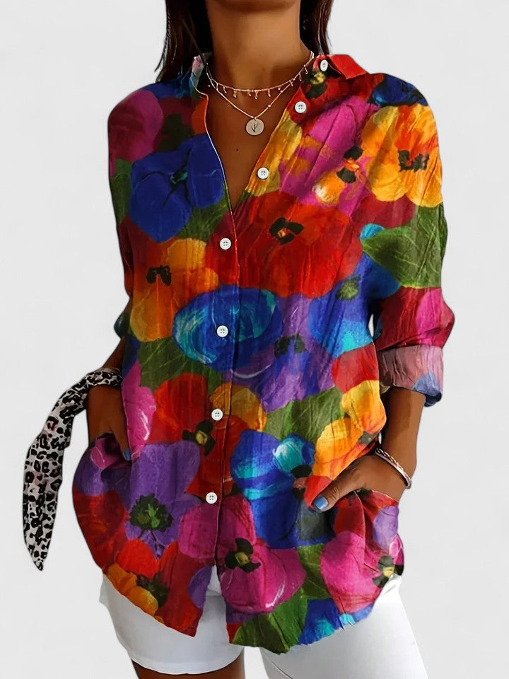 Women's colorful floral button shirt by Jesie-London featuring vibrant floral patterns and a classic button-up design.