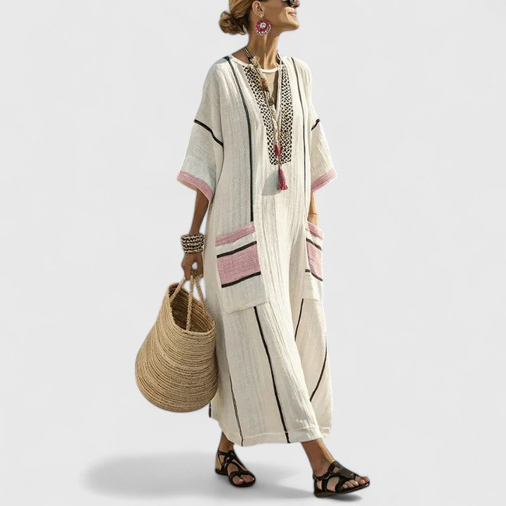 Elizabeth women's loose fit pocket maxi dress by Jesie-London, featuring a flowing silhouette and side pockets.
