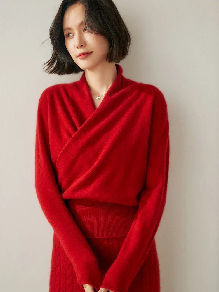 Women’s Jesie-London Kate elegant wrap crossover chic sweater displayed on a hanger, showcasing its stylish design and soft fabric.