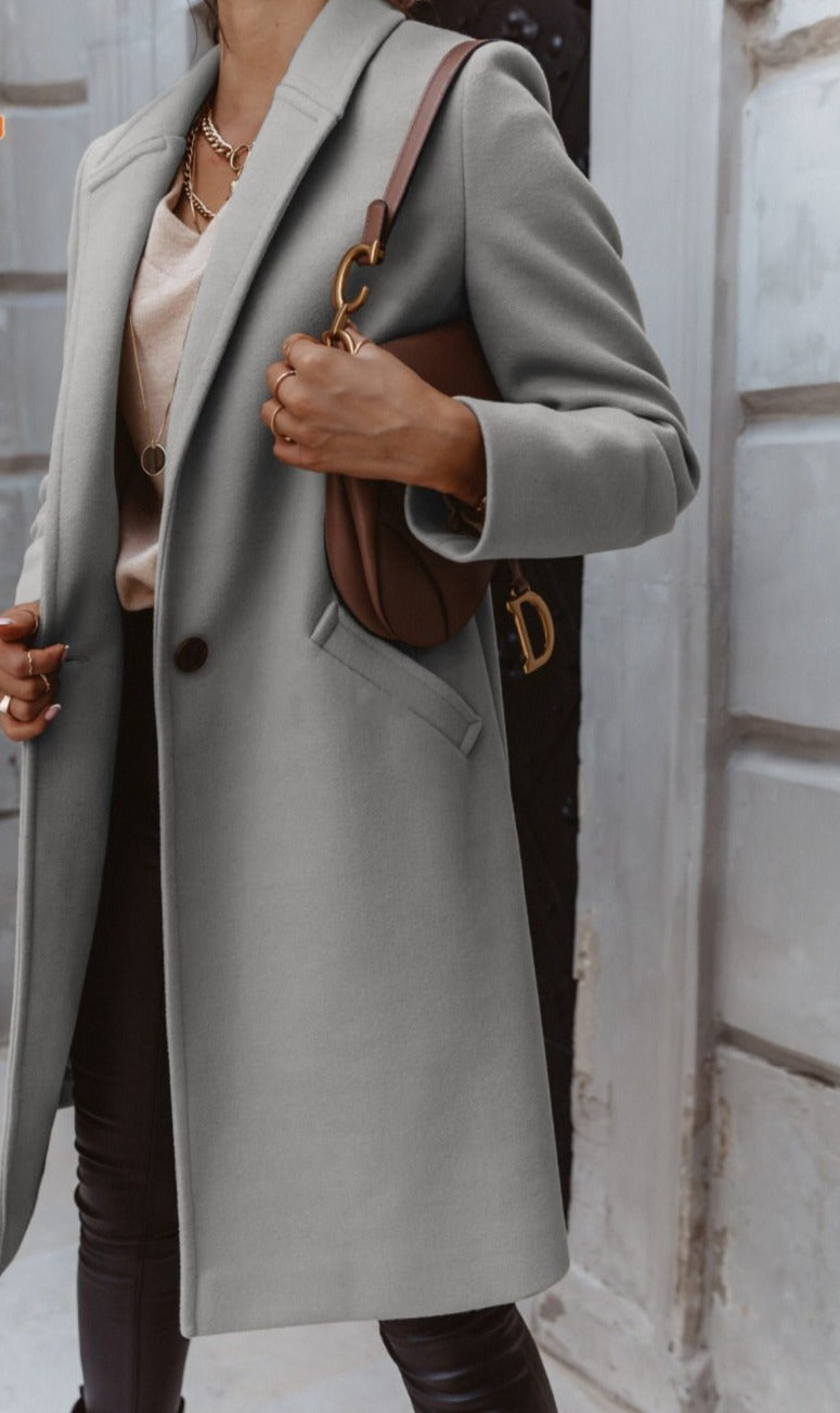 Elegant women's formal button front coat by Jesie-London, featuring a tailored design and classic style for sophisticated occasions.