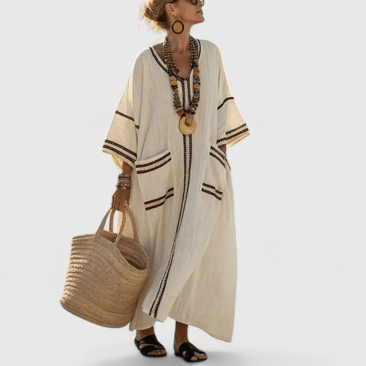 Women's loose fit maxi dress with pockets by Jesie-London, featuring a flowing silhouette and casual style.