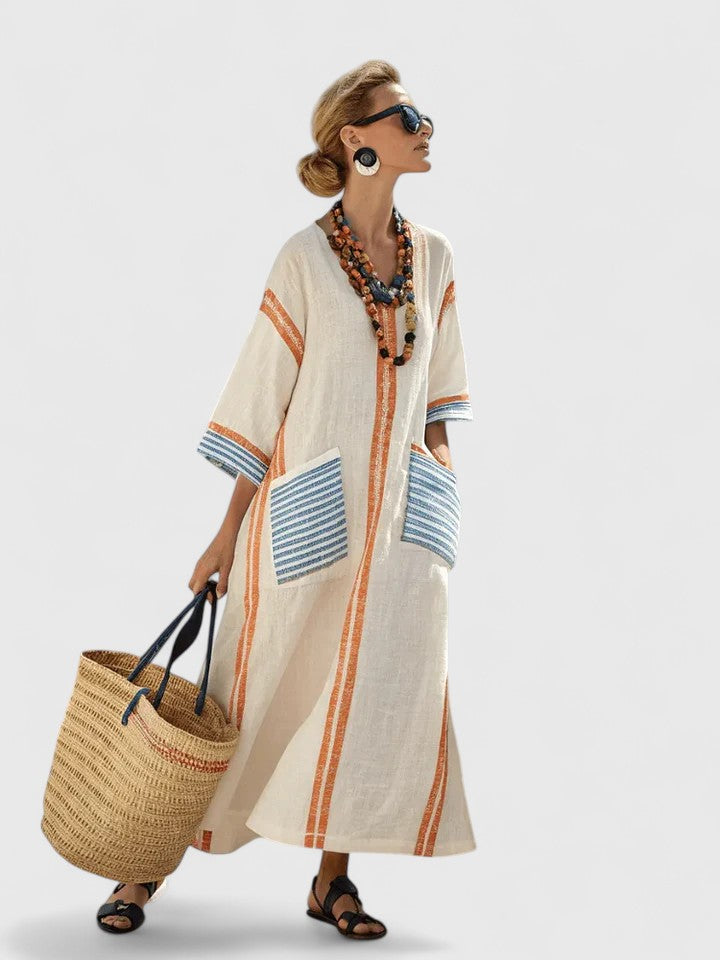 Jesie-London Abigail women's v-neck loose maxi dress in flowing fabric, displayed on a hanger against a white background.