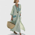 Women's loose fit maxi dress with pockets, Elizabeth by Jesie-London, shown in a flowing, comfortable design.