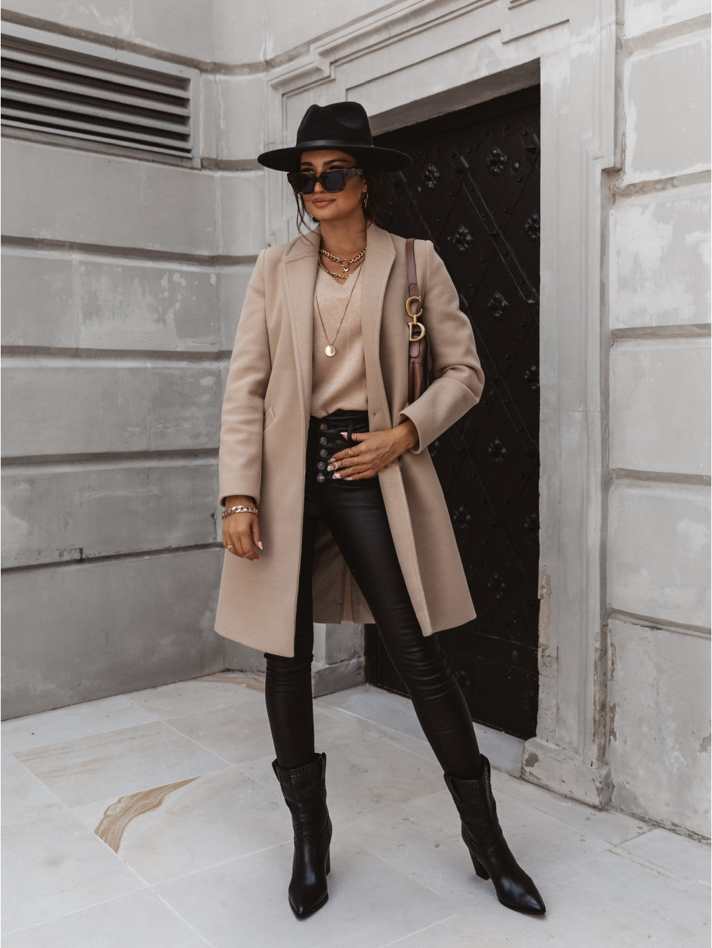 Women’s elegant Jesie-London Freya formal button front coat displayed on a hanger, showcasing its tailored design and classic style.